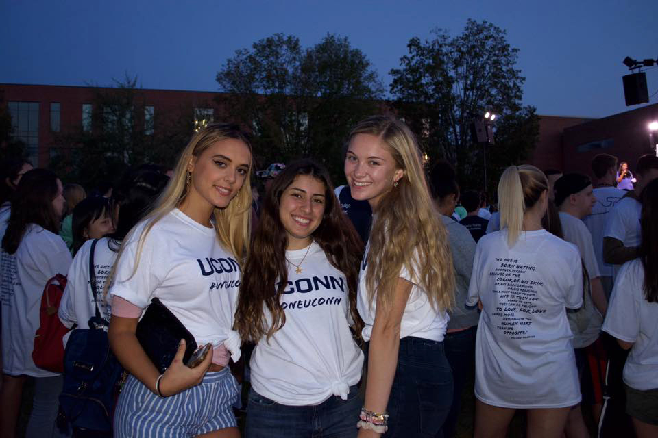 3 young women wear #oneUConn shirts