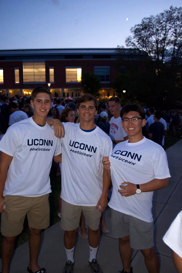 3 young men wear #oneUConn shirts