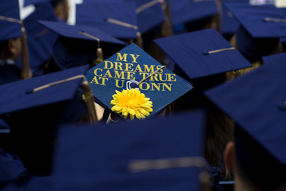 Blue graduation cap reads, My Dreams Came True at UConn