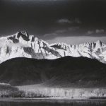 black and white photo depicting mountains bathed in morning light from Sierra Nevada from Lone Pine California