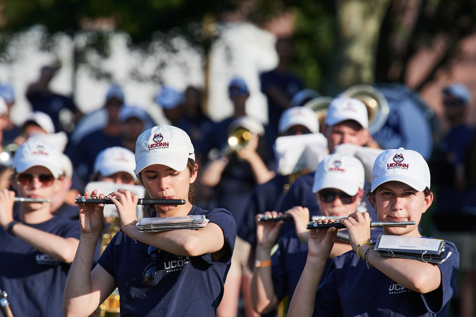 The UConn Marching Band performs along Mirror Lake