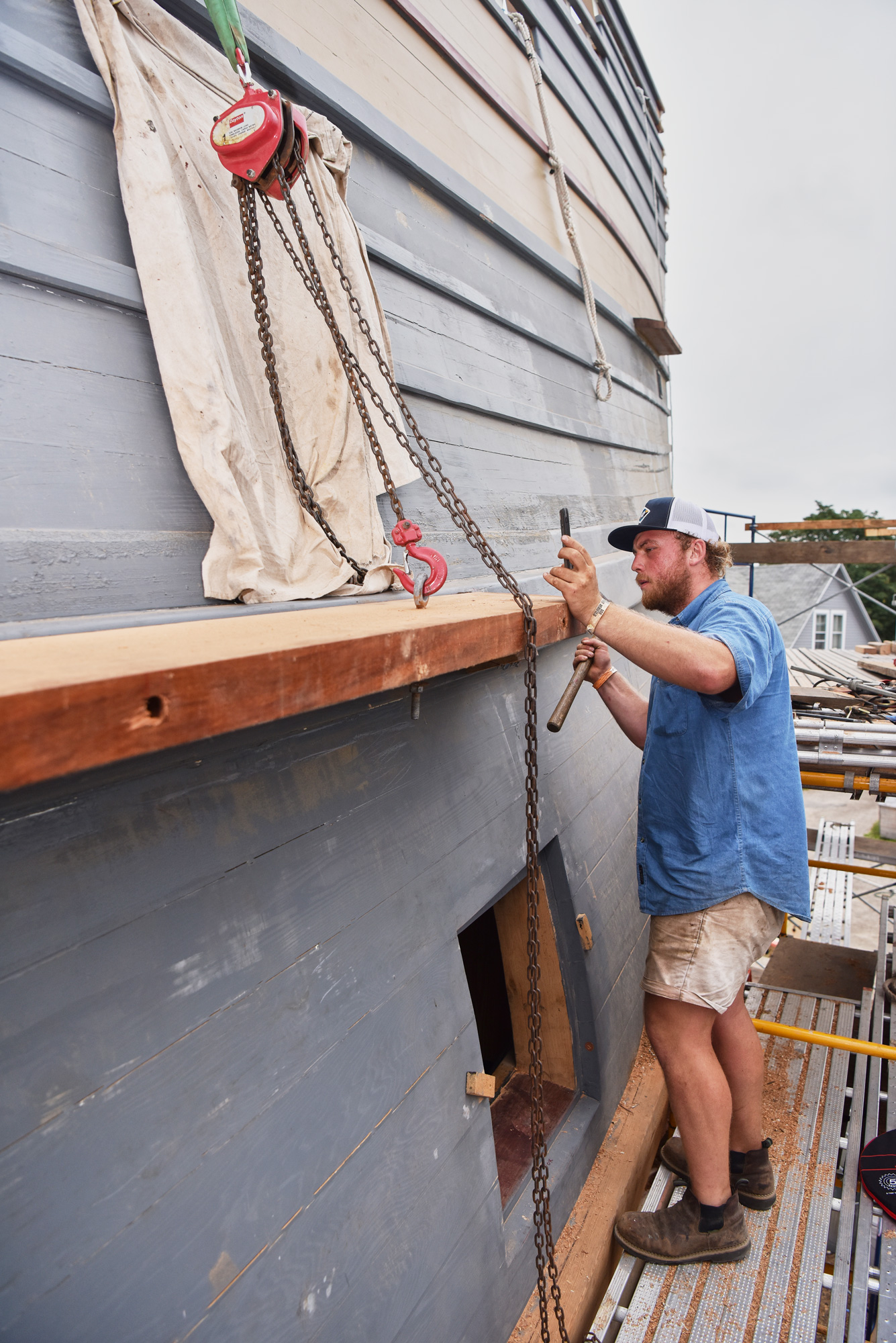 Casey Cochran '15 (CLAS) works on renovations to the Mayflower II at Mystic Seaport