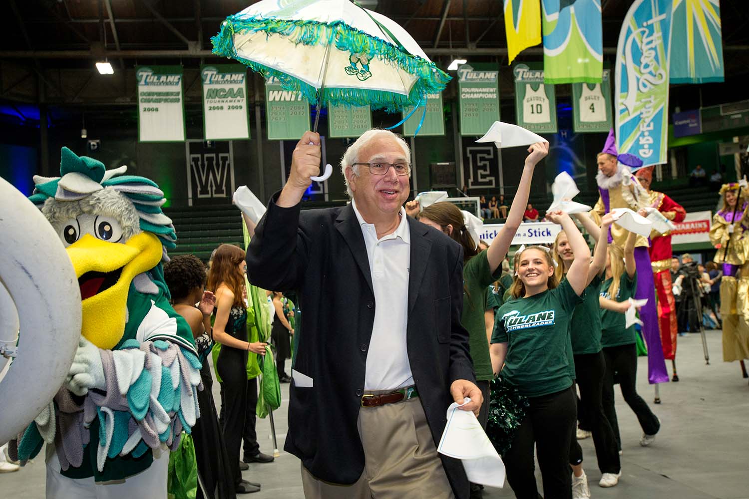 Cowen participates in a parade with other Tulane students and pelican mascot