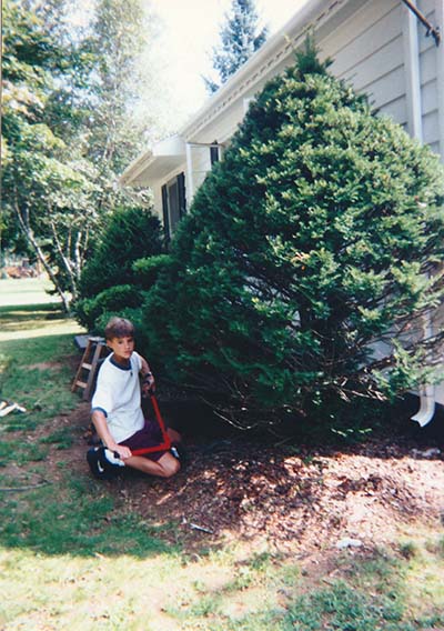 López- Jensen, a young child here, pruning a large bush