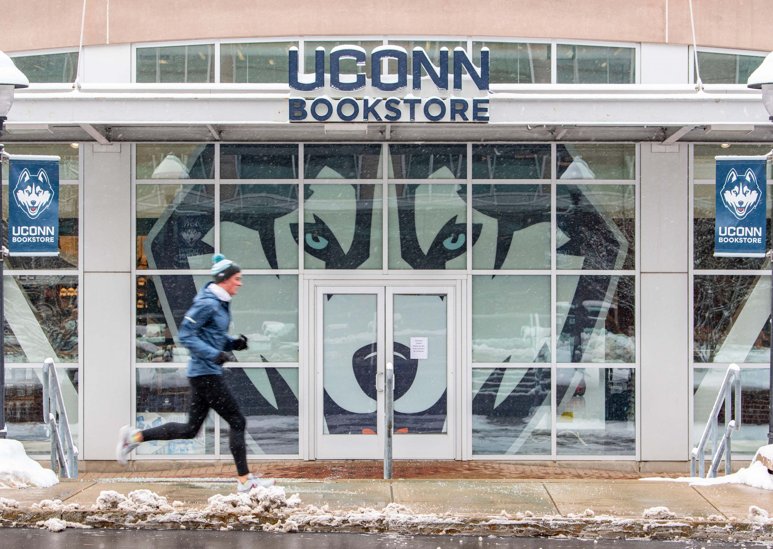 UConn Bookstore store front with UConn mascot wall decal