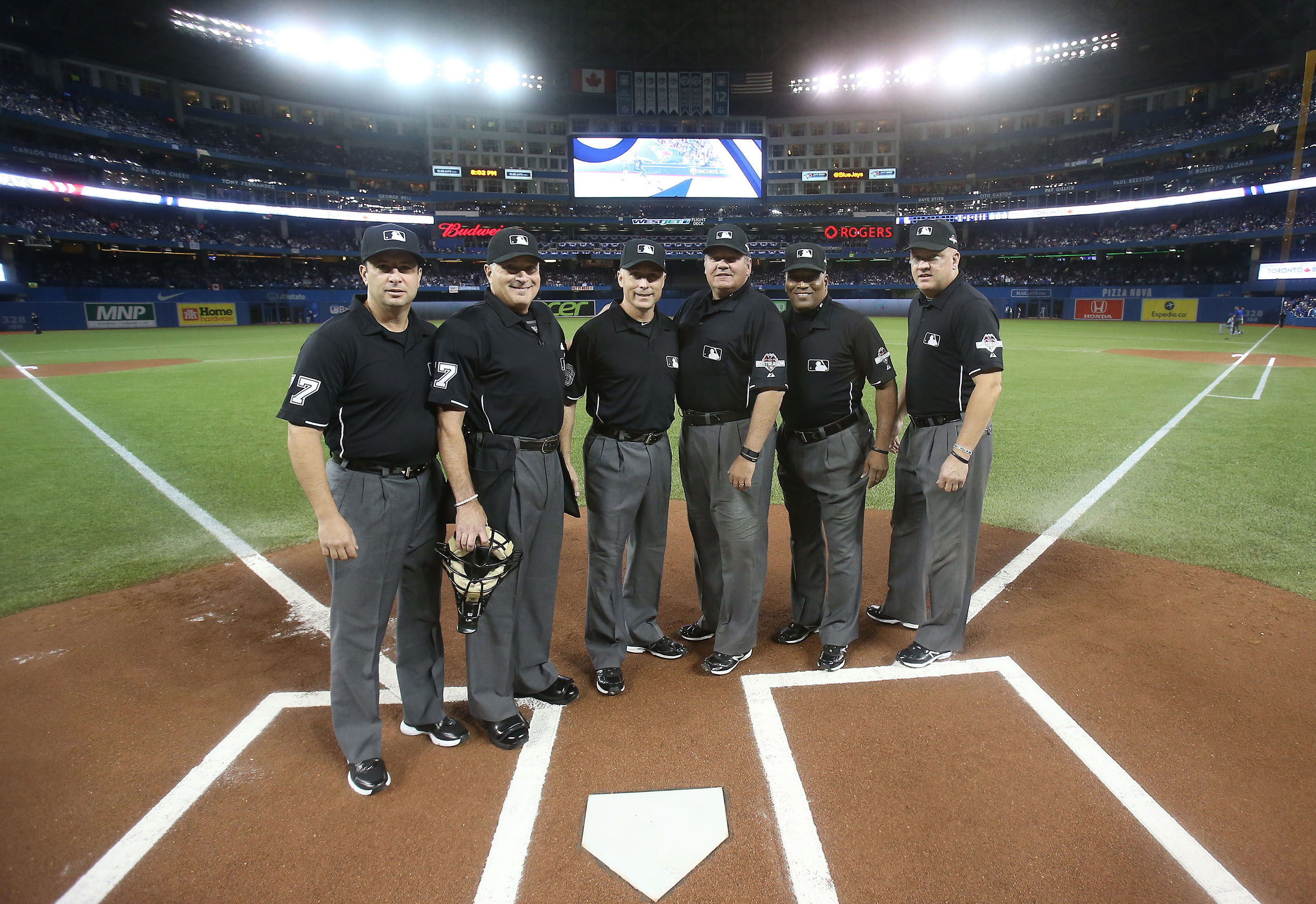 Umpires gather before Game 3 of the 2015 American League championship series in Toronto.