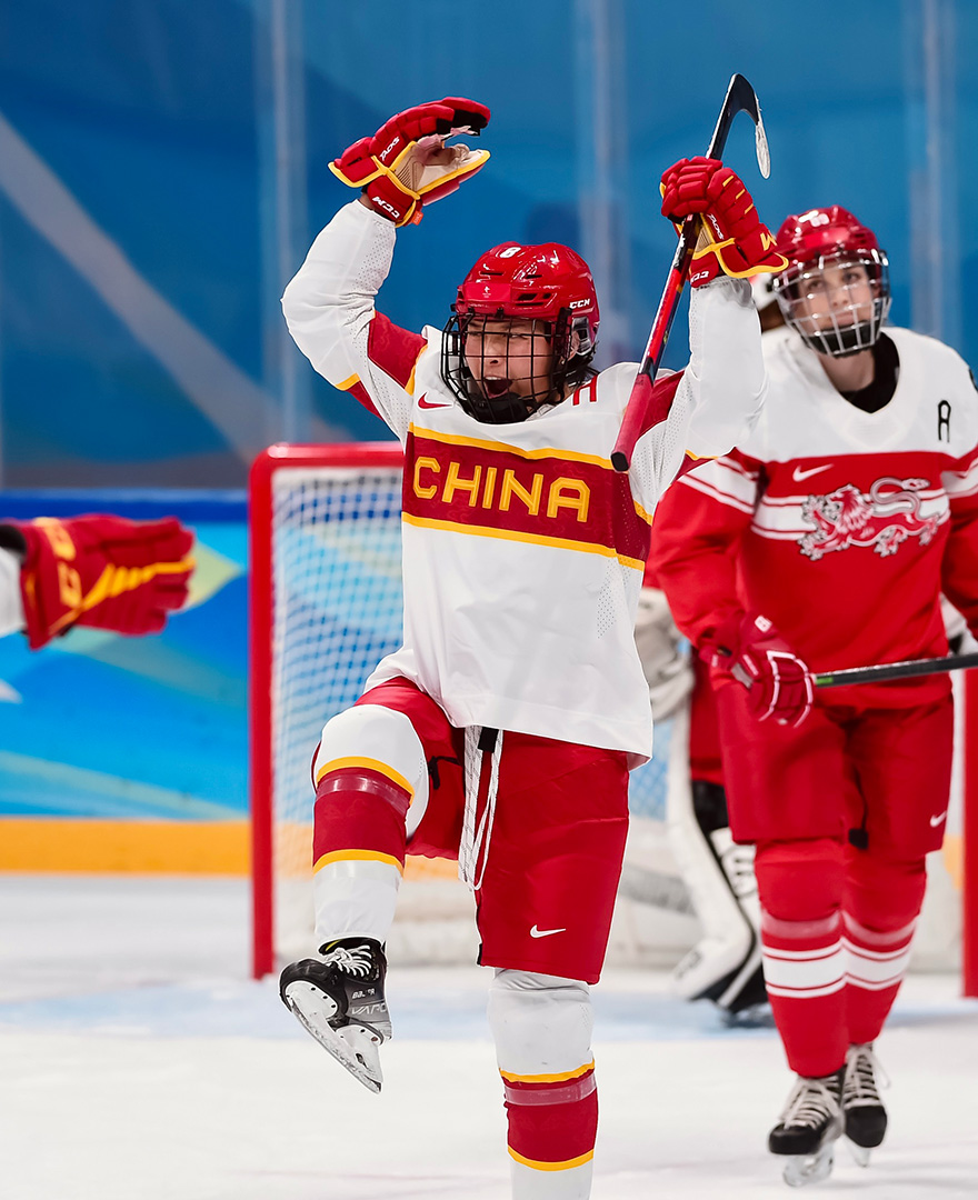 Leah Lum competed for Team China women’s ice hockey. Here, seen cheering