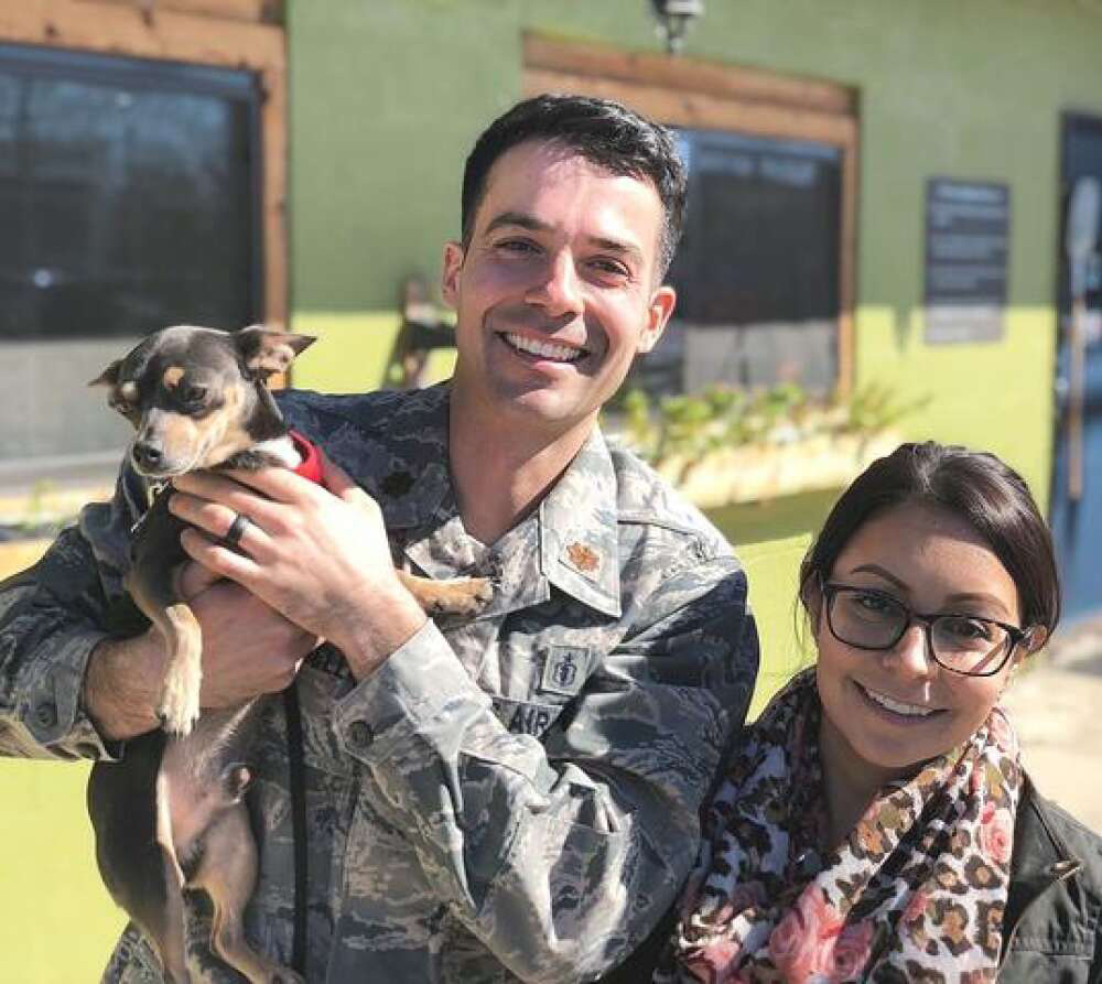 Anthony Carbonella with pet and wife