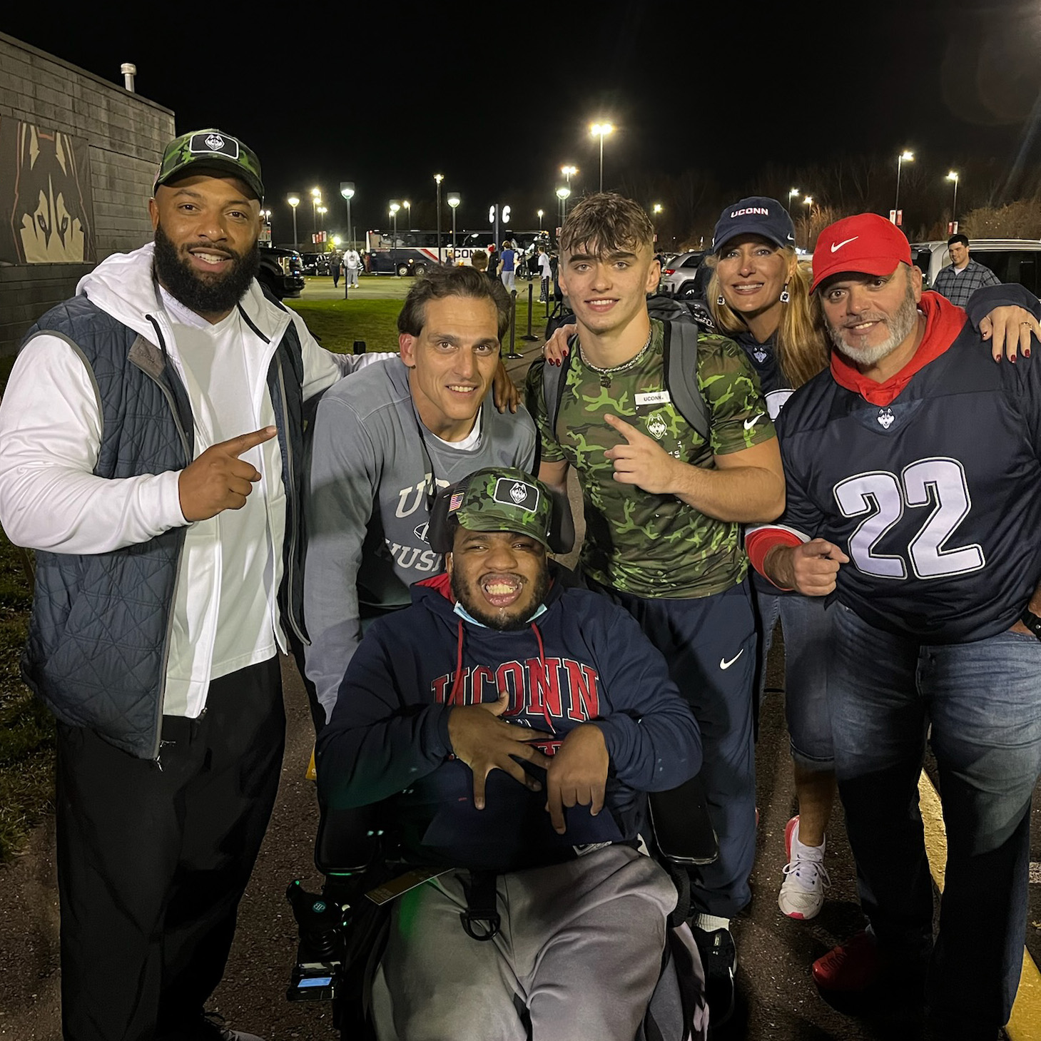 Keith Gaither surrounded by fellow UConn huskies, former Husky coach E. J. Barthel, Farina, running back Victor Rosa and his parents Deanna and Glenn.