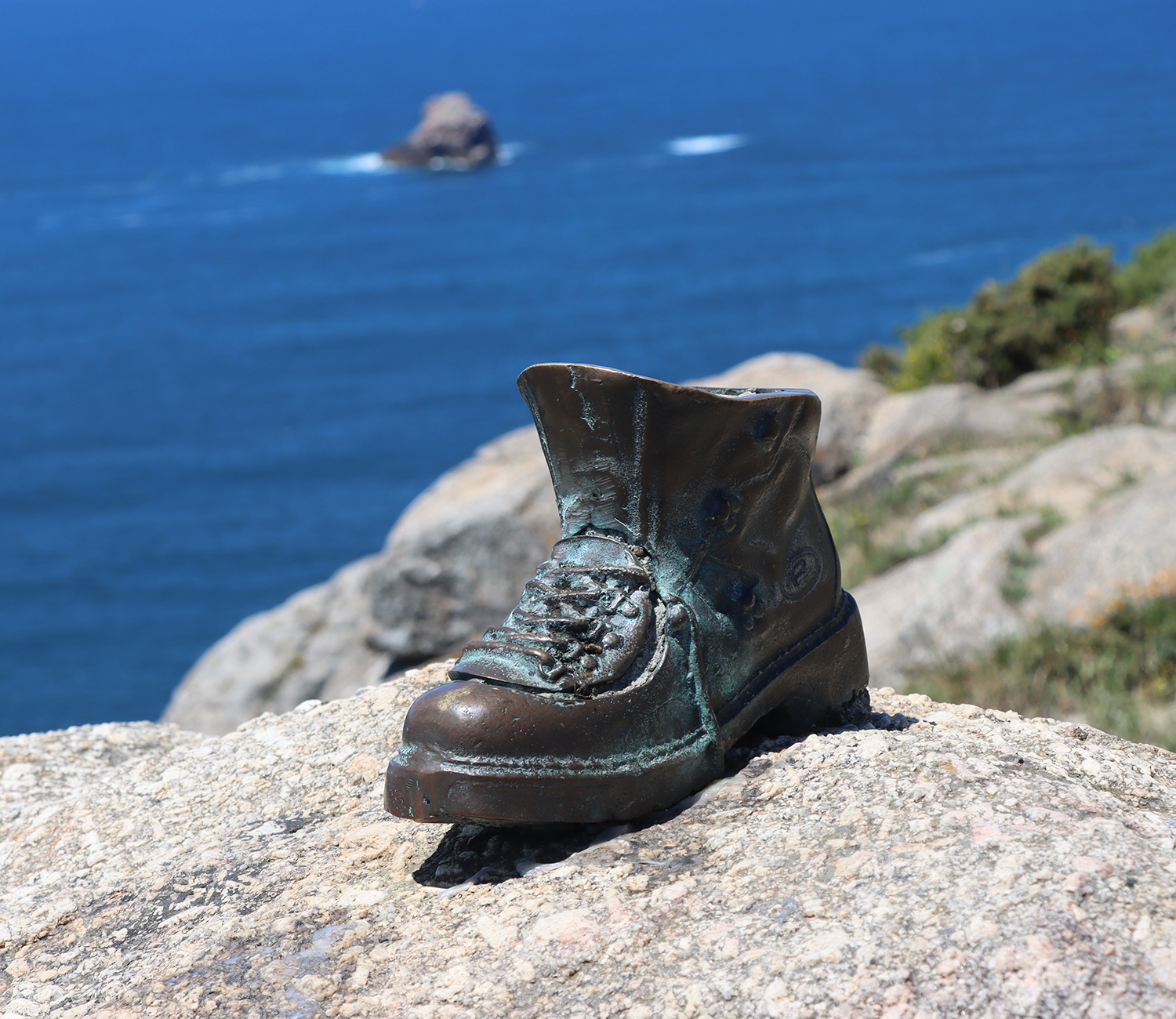 bronzed boot on stone
