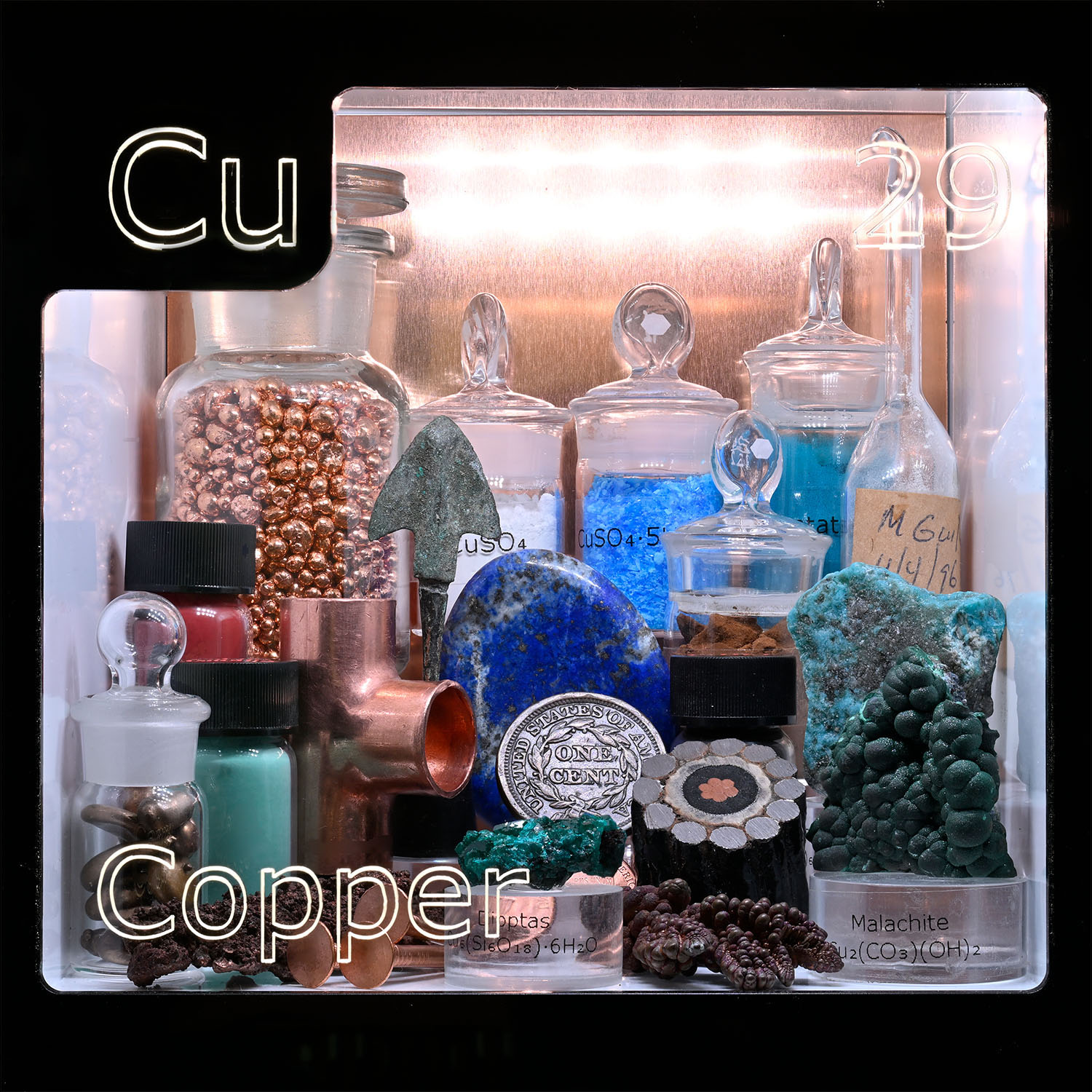 Periodic Table Display - close up of Copper and the items that contain that element