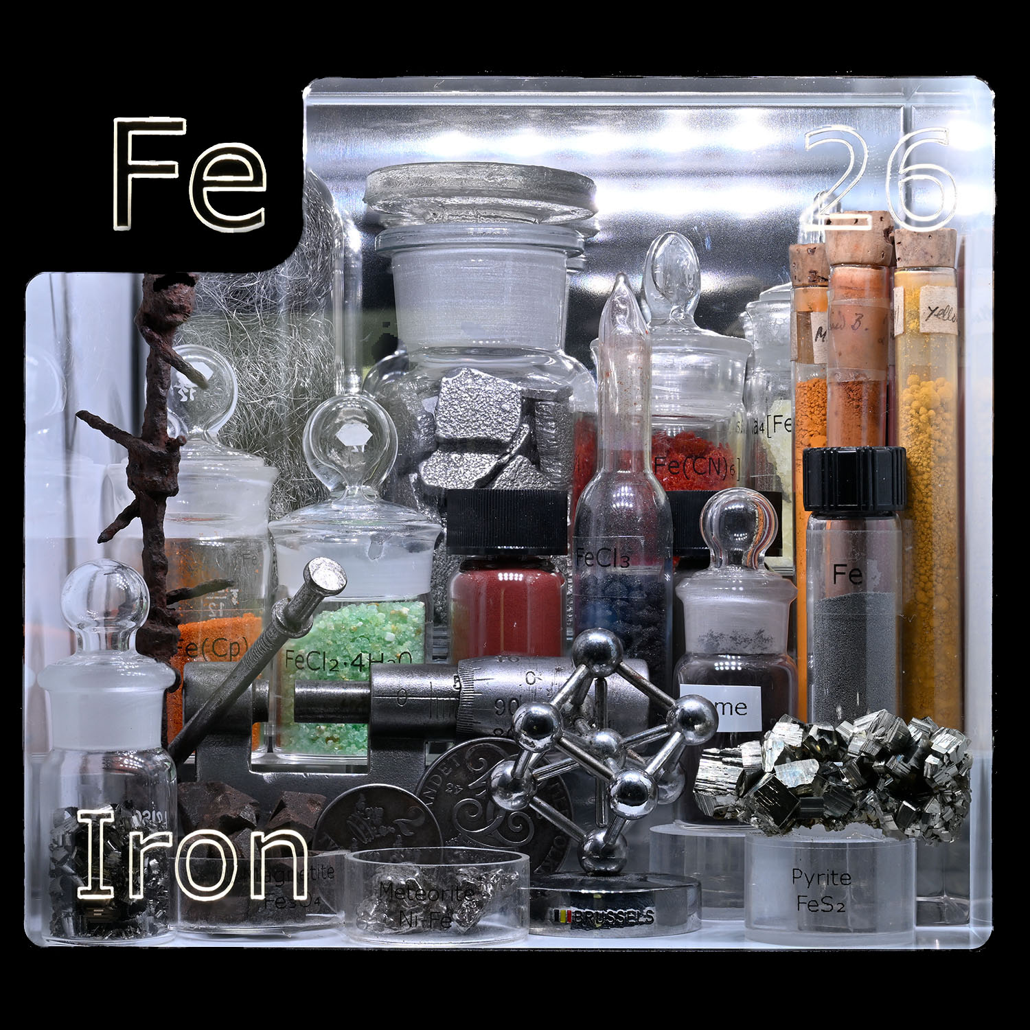 Periodic Table Display - close up of Iron and the items that contain that element