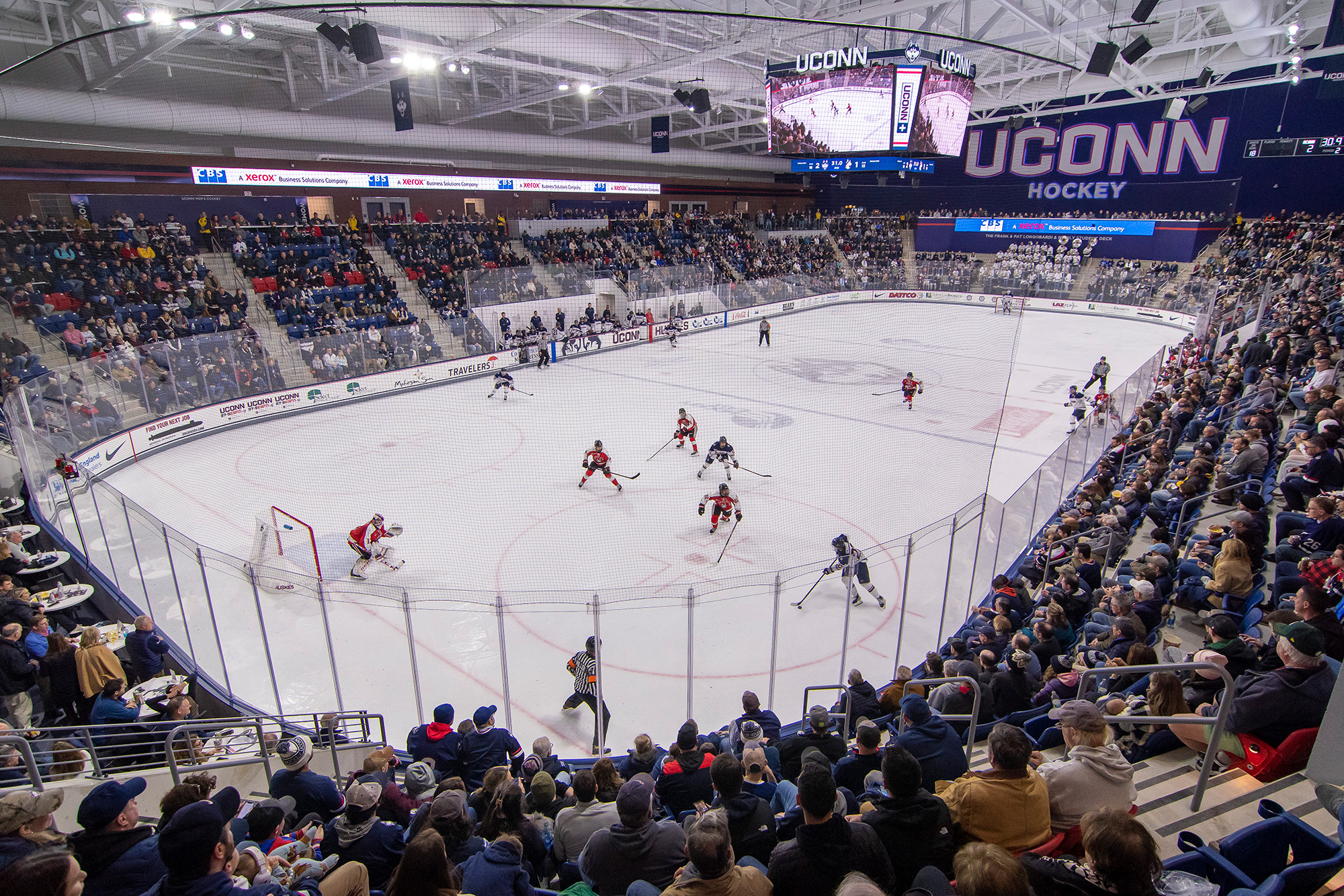 The Toscano Family Ice Forum at UConn Storrs was christened Jan. 14 and 15 with the women beating Merrimack and Vermont, and the men battling Northeastern (shown) for a tight 4-3 loss.­