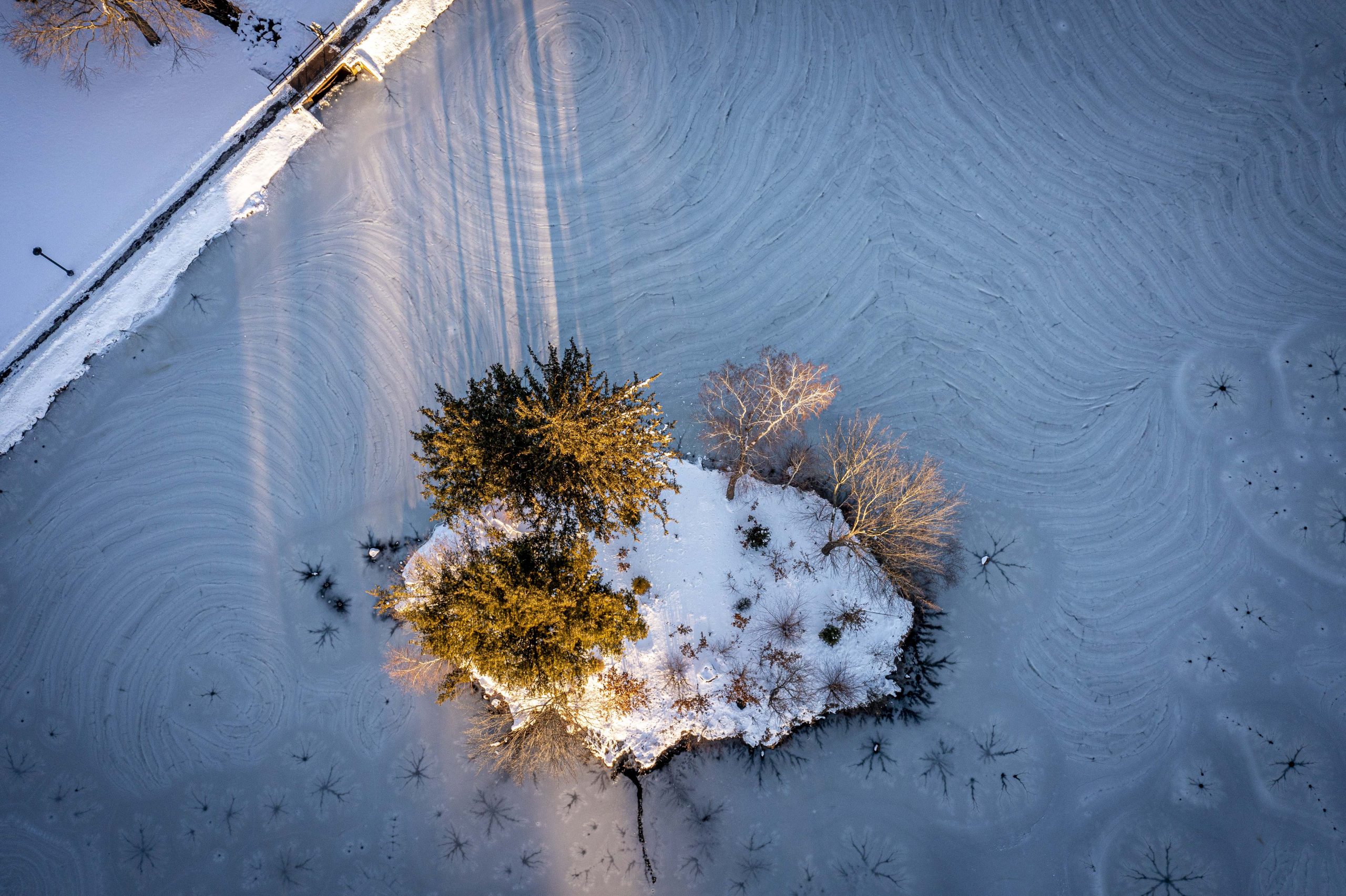 Looking down at ice on Mirror Lake from a drone after a winter snowstorm. Jan. 8, 2022. (Sean Flynn/UConn Photo)