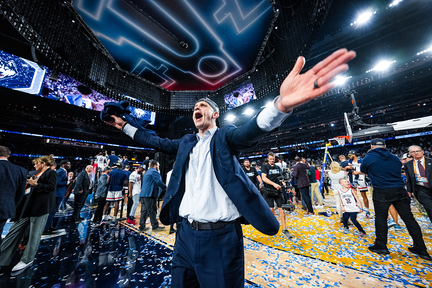 Coach Dan Hurley on the court after the 2023 men's national championship win over San Diego State.