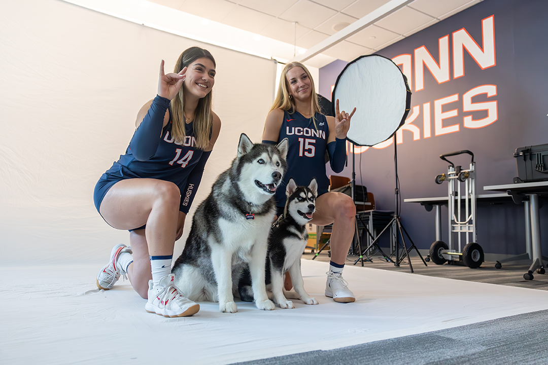Jonathan XIV hangs out with members of the UConn women's volleyball team during the team's media day in the Rizza Performance Center on Aug. 14, 2023.