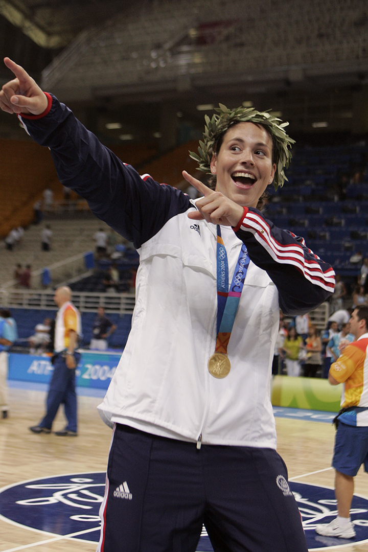 ATHENS - AUGUST 28: Sue Bird #6 of USA celebrates winning gold against Australia in the women's basketball final game on August 28, 2004 during the Athens 2004 Summer Olympic Games at the Indoor Hall of the Olympic Sports Complex in Athens, Greece. 