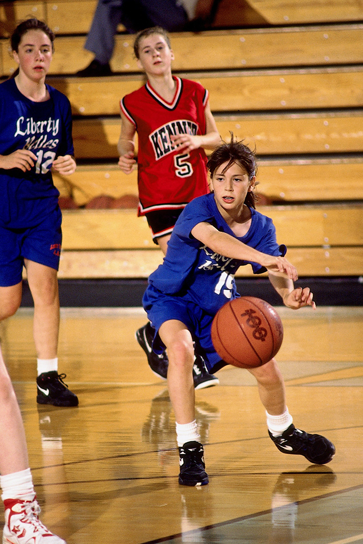 SALT LAKE CITY - 1992: Current member of the Seattle Storm, Sue Bird, makes a pass during the AAU National Girls 11 & Under championships played in July of 1992 in Salt Lake City, Utah.