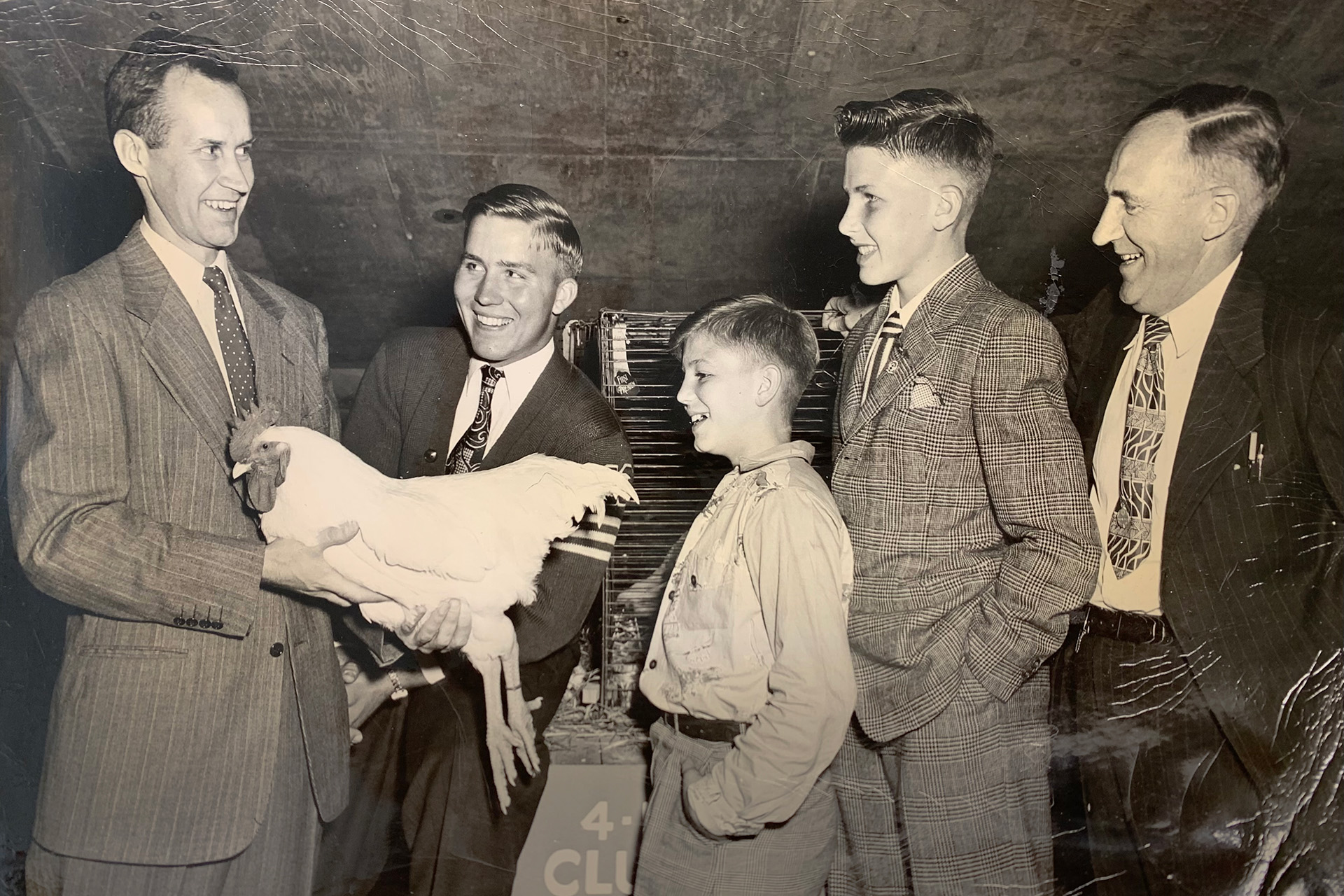 UConn Extension agent and poultry sciences professor William Aho, left, talks with 4-H Club students visiting UConn in the mid-1950s