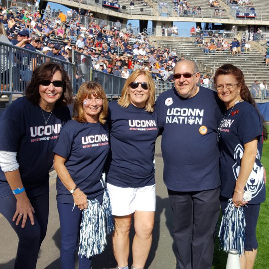 Stephanie Giancola '78 with fellow UConn Cheerleaders at 2017 homecoming