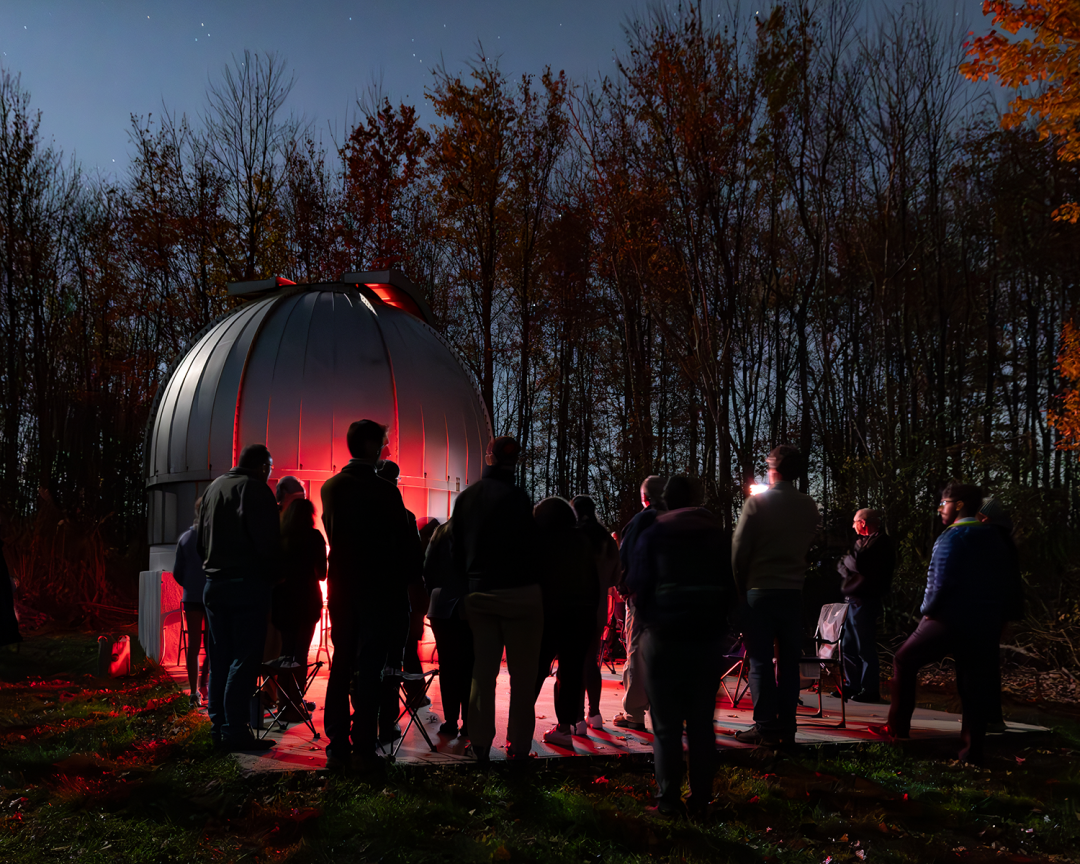 Team of employees, students, researchers, an alum, and an elite telescope builder work on the observatory.
