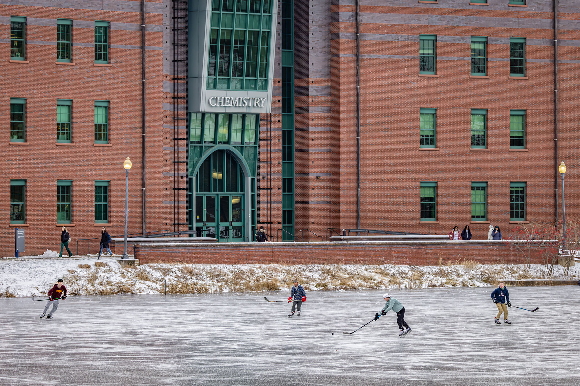 Mid-January, students play ice hockey on the frozen Swan Lake