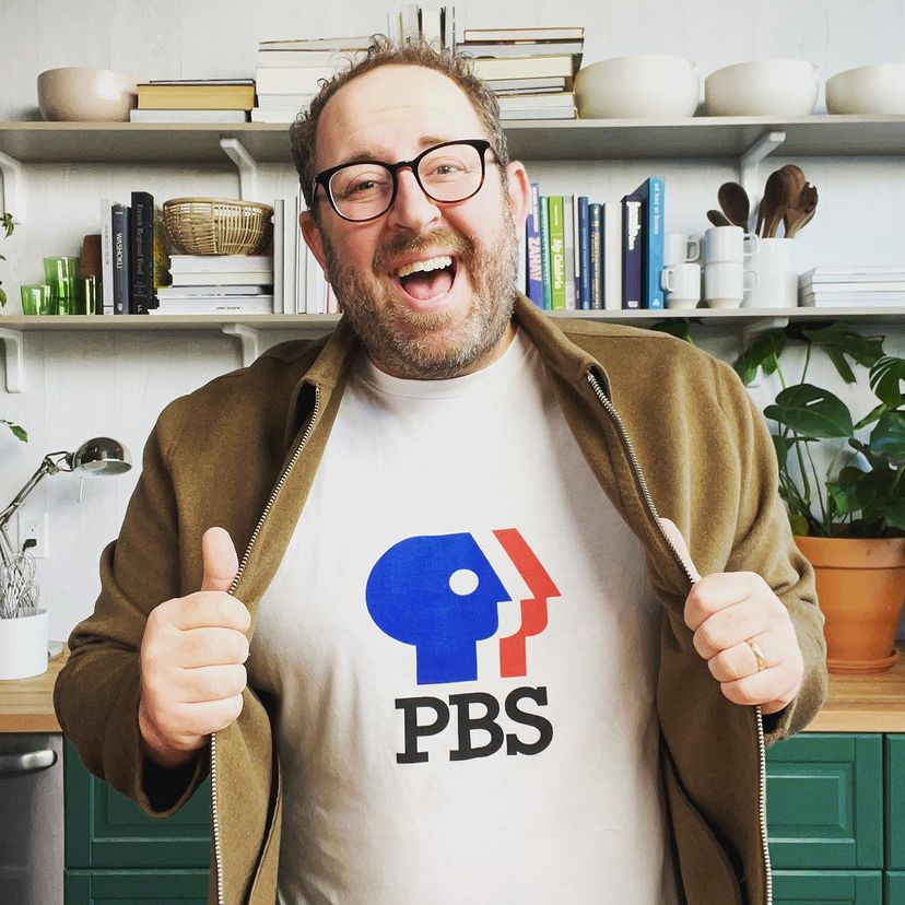 Joel Gamoran shows off his PBS shirt in test kitchen
