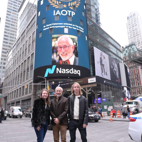 David Fetterman with his family at the Times Square NASDAQ billboard