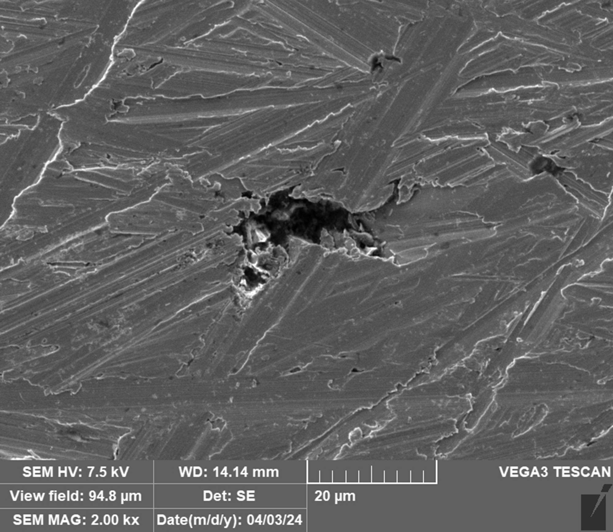 details of pitting and corrosion in steel under an electron microscope