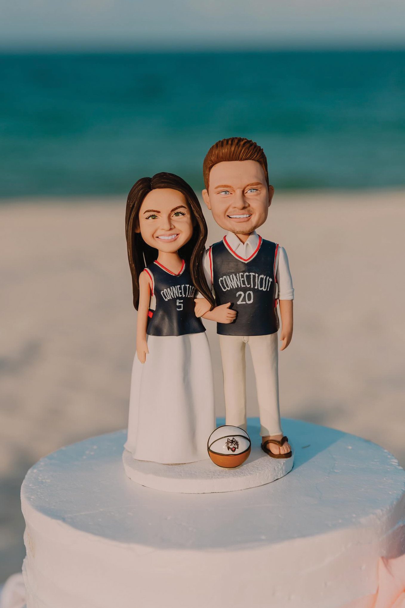 Kaszuba-Neville bobble heads atop a wedding cake