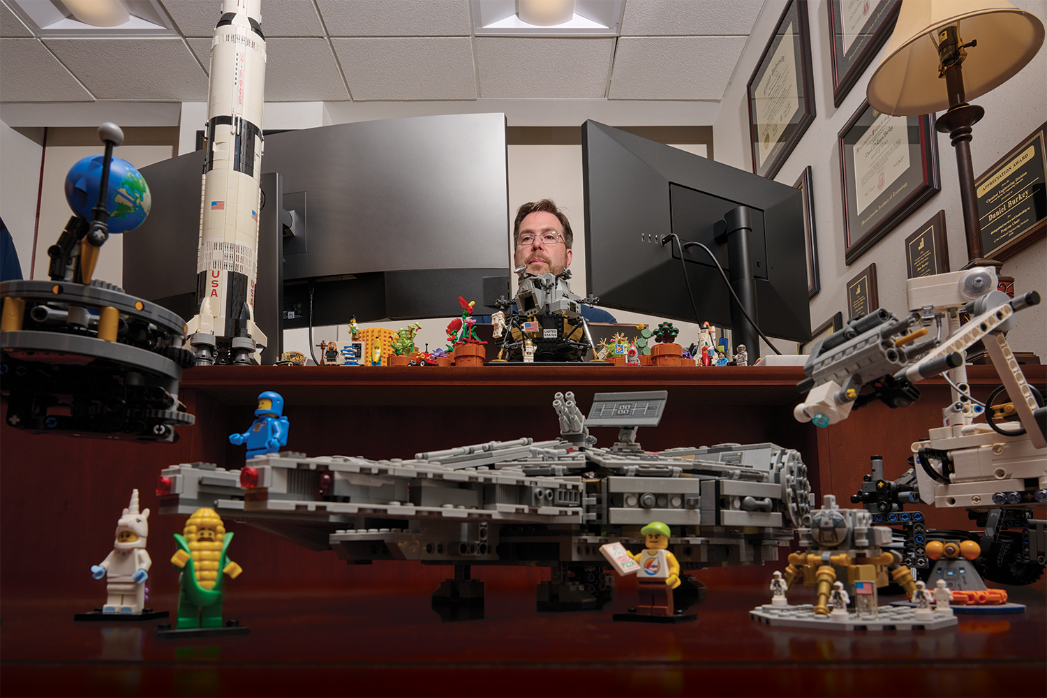 Daniel Burkey, associate dean of engineering, with many Legos around his office on June 12, 2024.