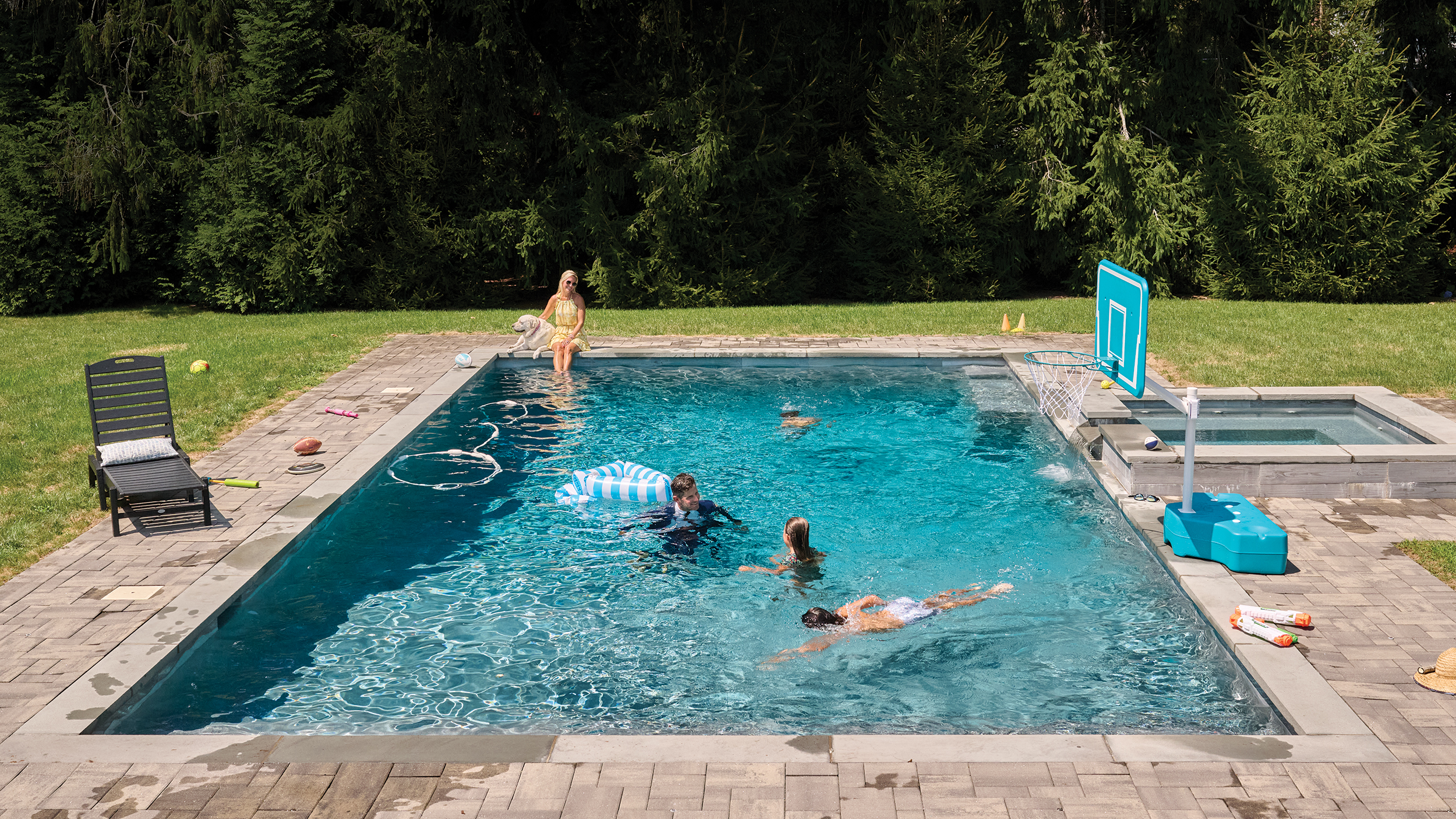 Orlovsky joins his family in a swim at his pool.