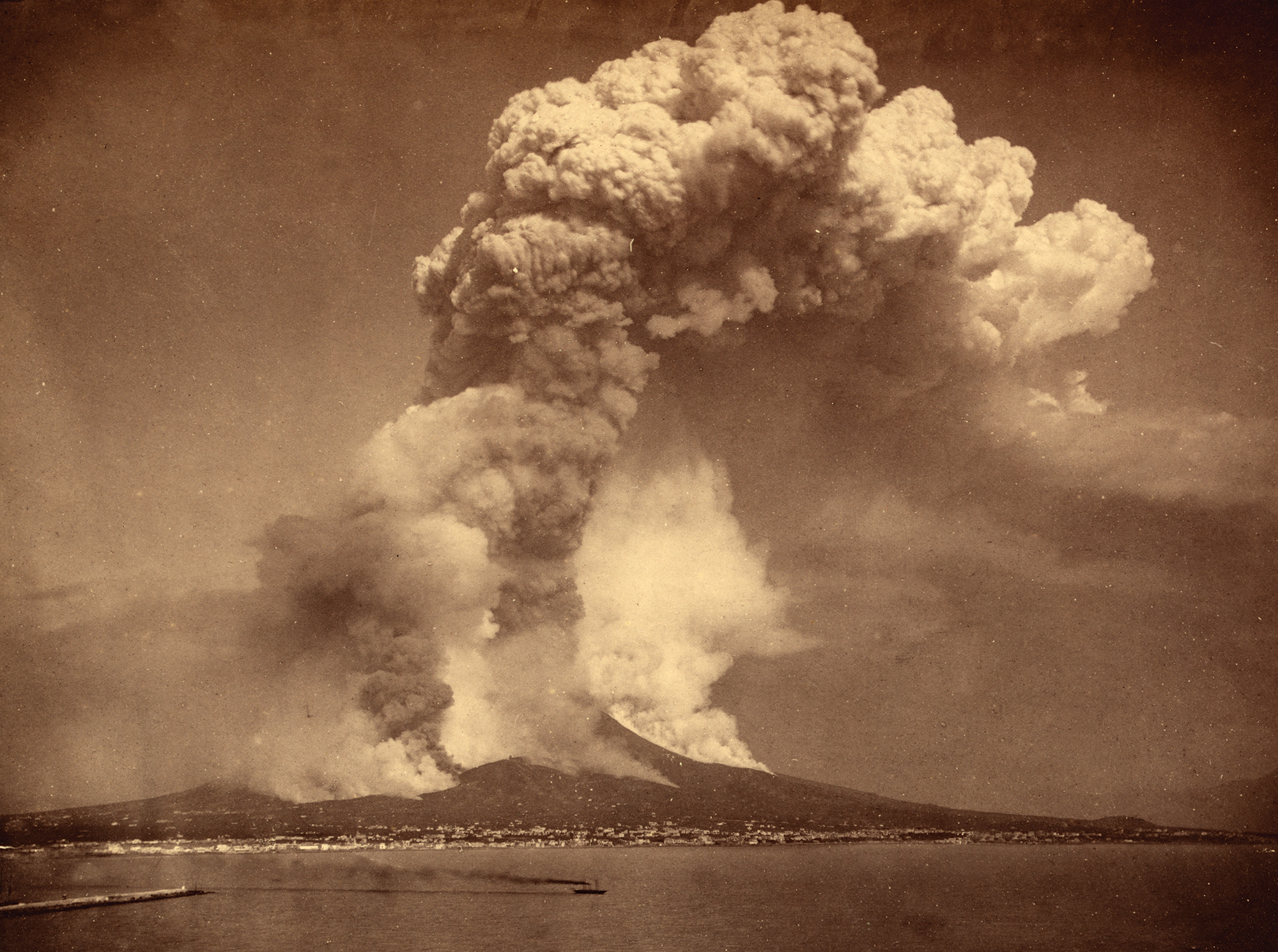 sepia-toned archival image of Mount Vesuvius erupting