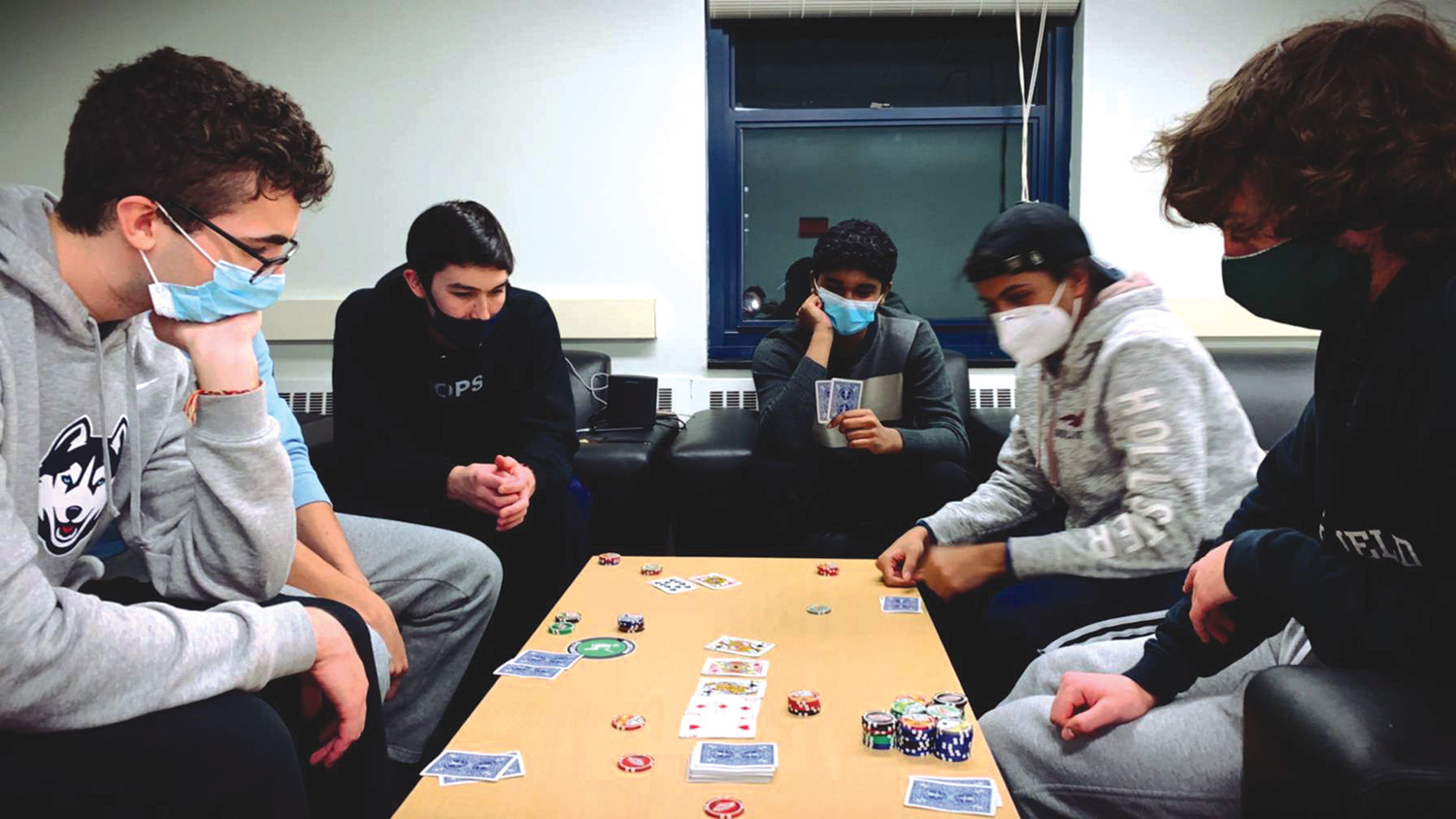 Mario Boozang, Michael MacKinnon, Nitish Rajagopal, and Sahib Sandhu play poker