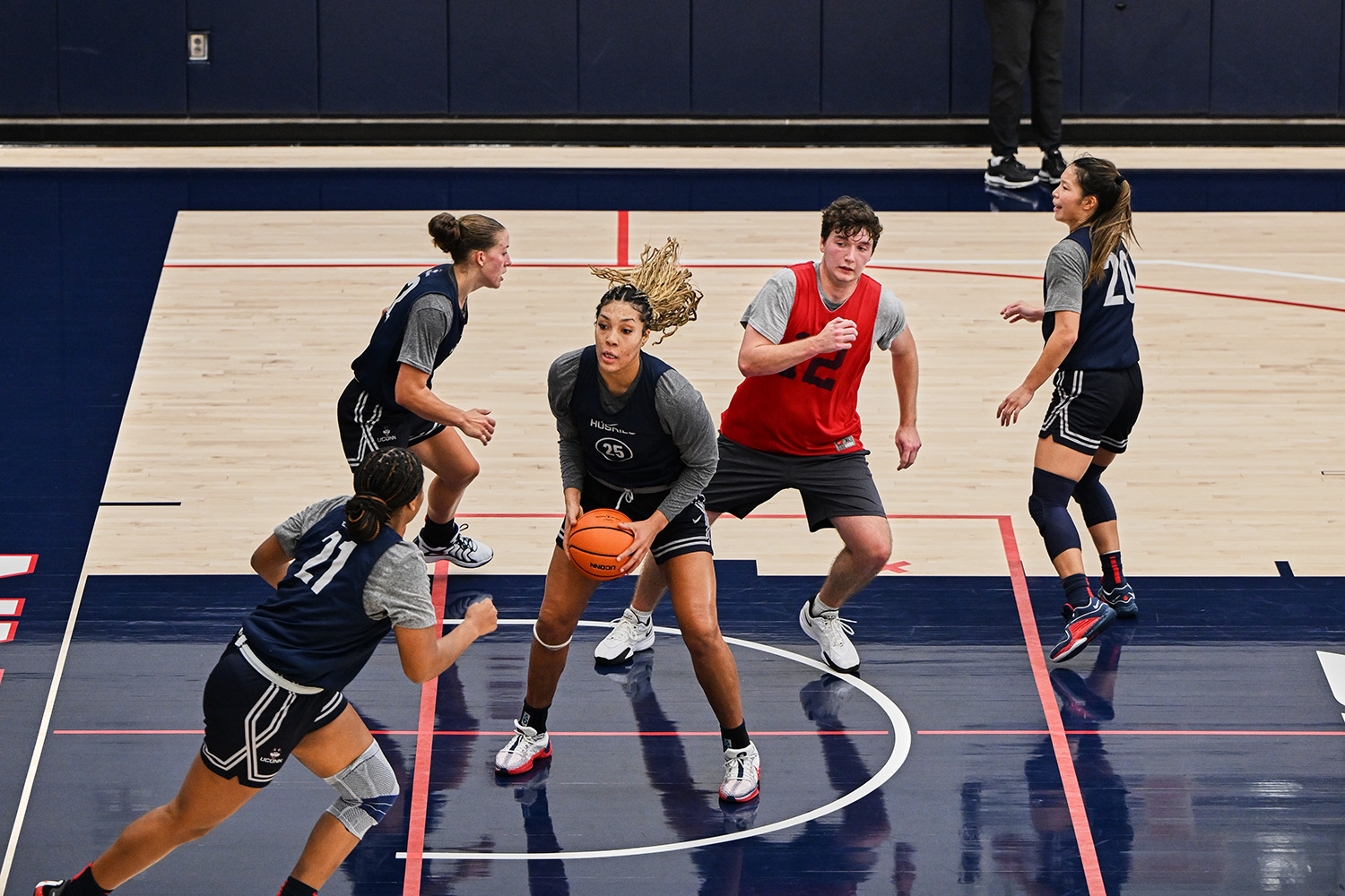 Four members of the women’s basketball team during team practice.