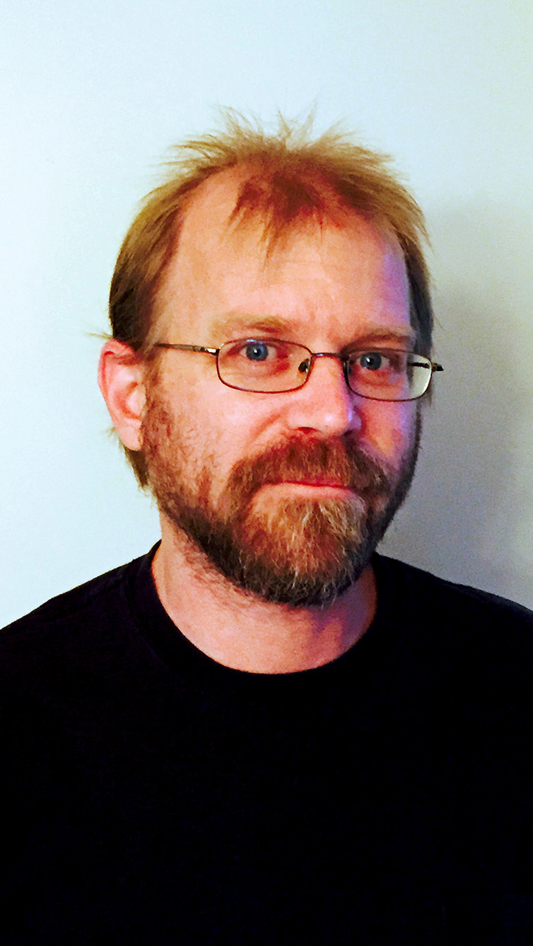 bearded male in black tee