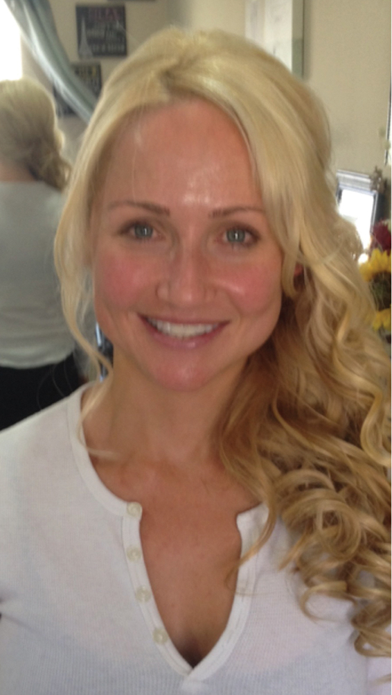 blond female with freshly washed face and white blouse