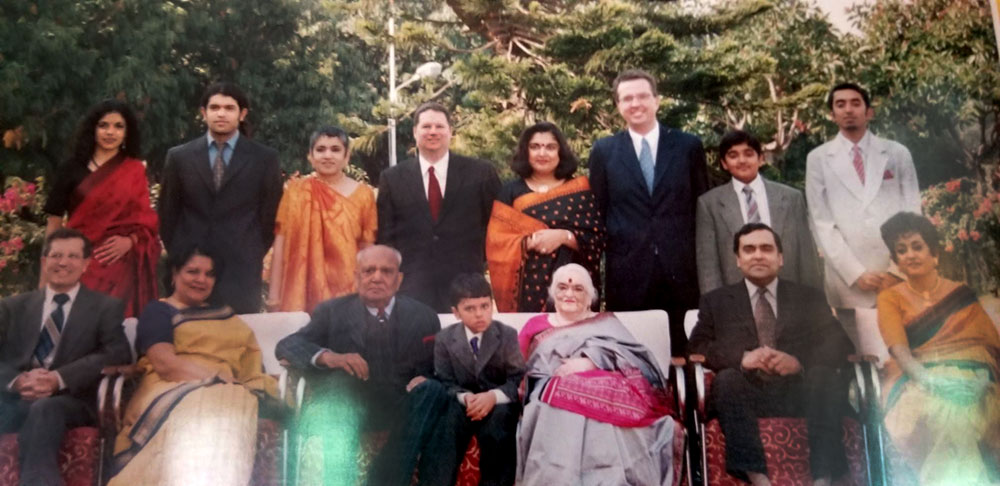 Family photo including Manisha, her father, her mother, her two sisters and brother.