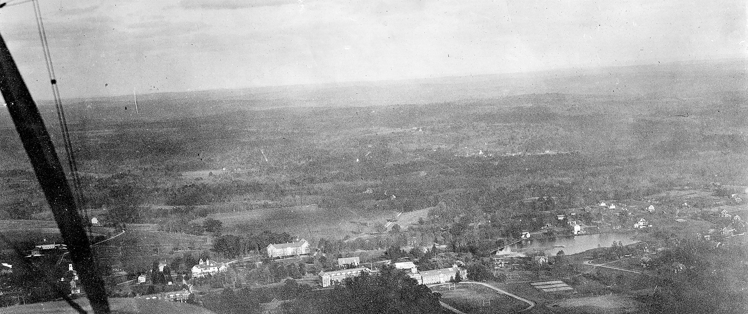 1925 aerial biplane photograph shows Mirror Lake to the right and Horsebarn Hill to the left.