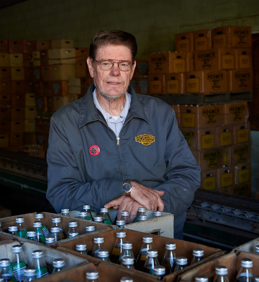 Bill Potvin '67 (CAHNR) with his mother at the Hosmer Mountain Bottling Company in Columbia on Oct. 23, 2019.