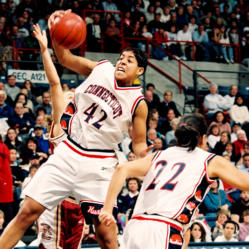 UConn's Nykesha Sales rebounds during a game against Boston College, Storrs CT 1996.