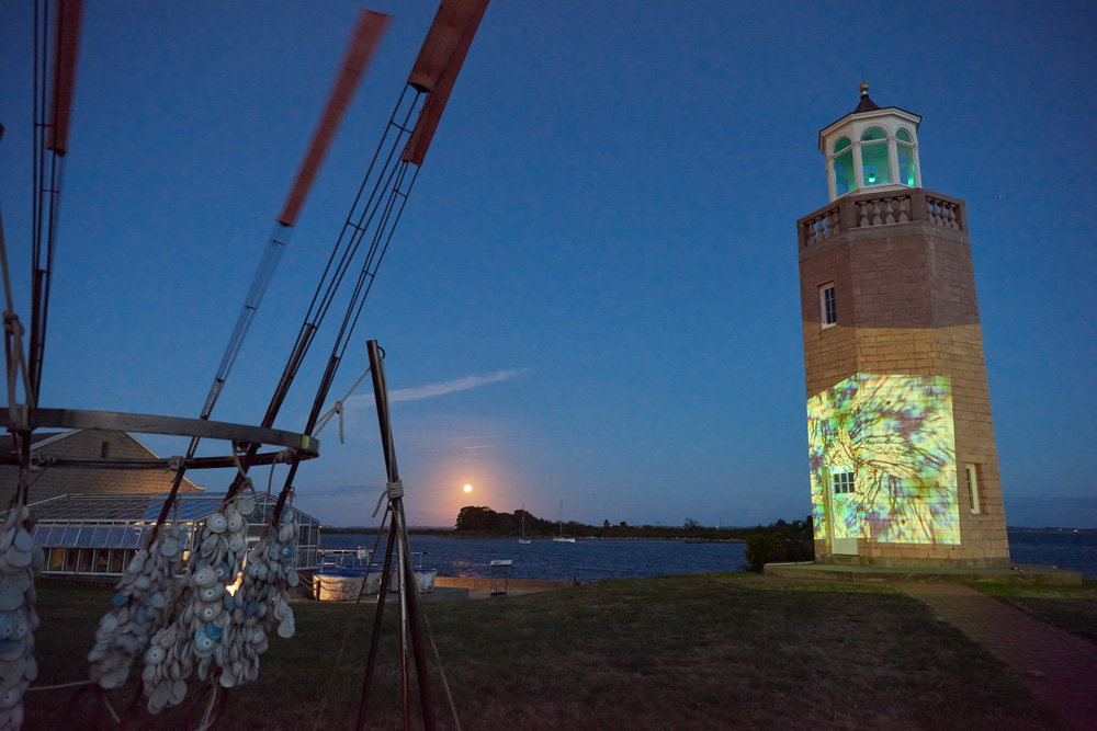 Videos by Benthaus Studios projected onto the Avery Point Lightouse on Sept. 1, 2020 as part of the Open Air by Night art exhibition.