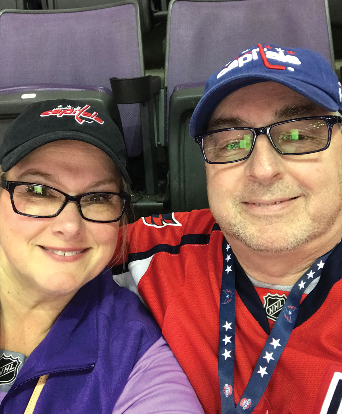 LaFlamme and with his wife, entrepreneur Carolyn Thompson, at a Stanley Cup playoff game — the two are longtime Washington Capitals fans.