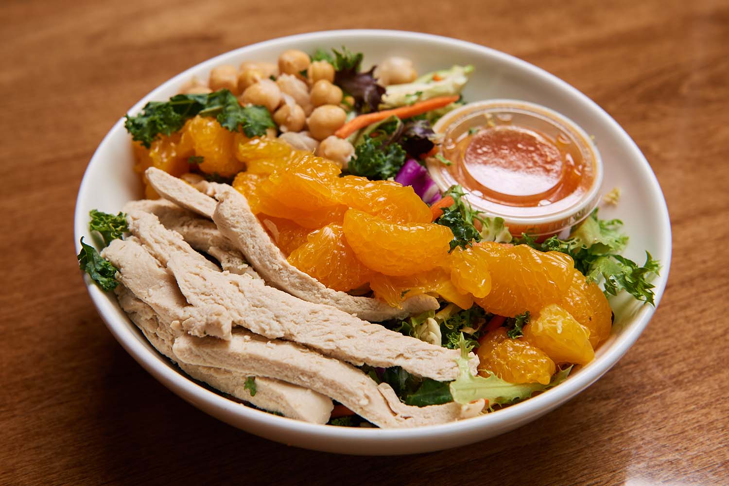 orange chopped salad with vegan faux chicken