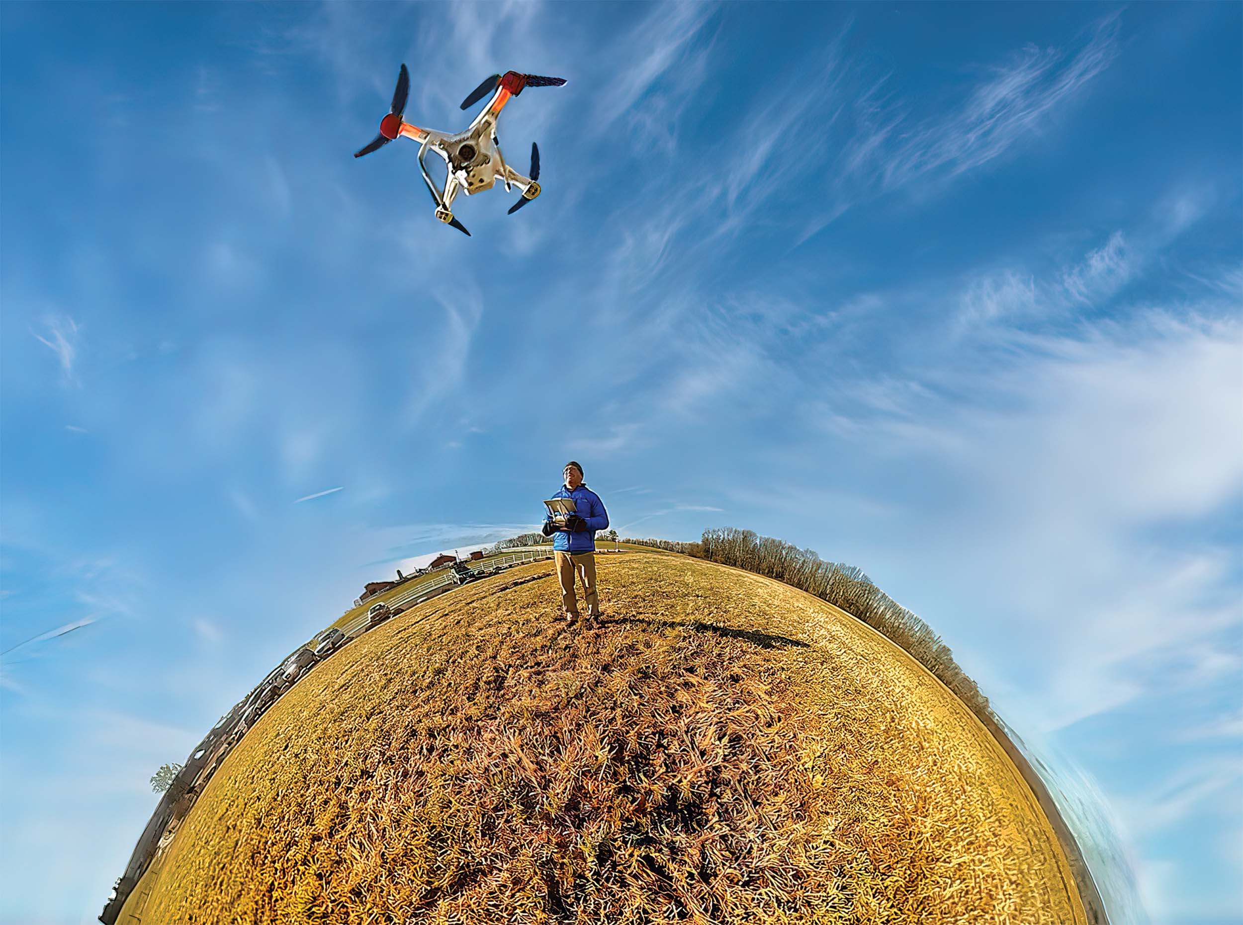 A warped lens view of a man piloting a drone