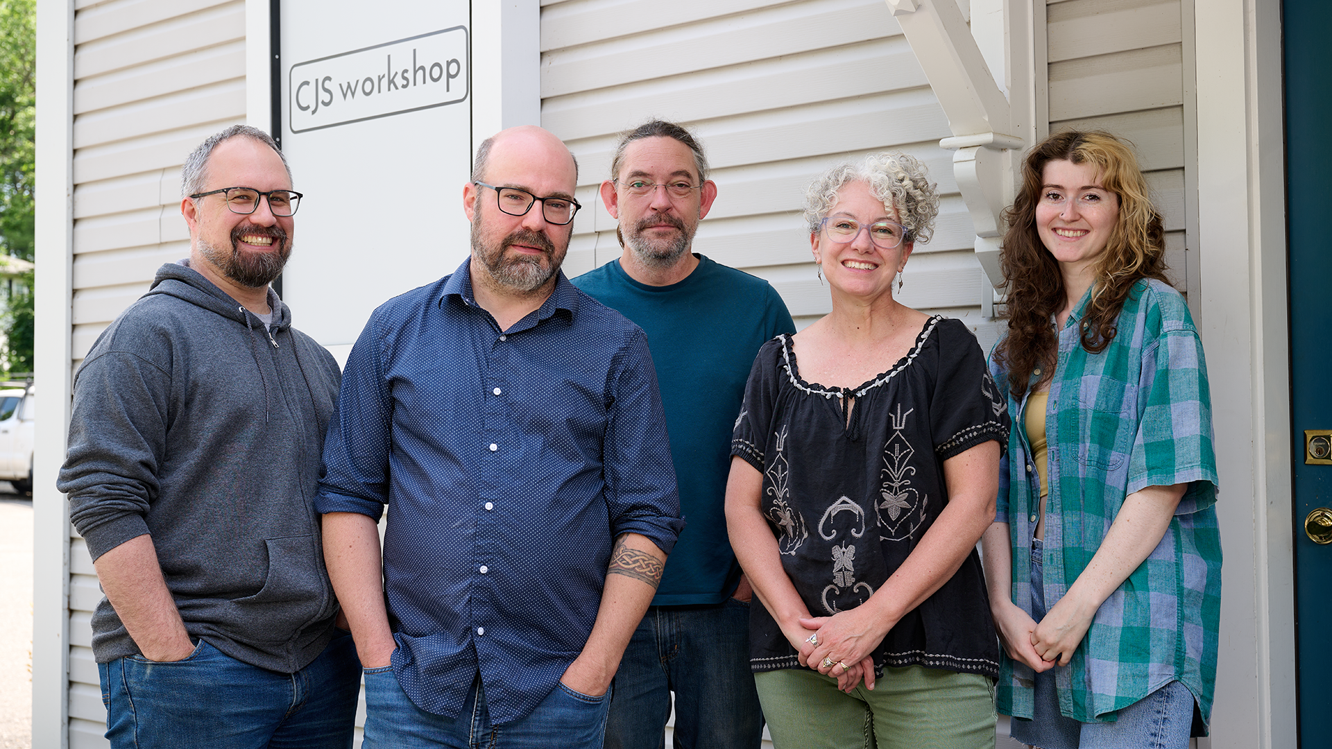 From left: Dana Samborski '01 (SFA), '15 MA; Rob Saunders '96 (SFA); Will Pike '03 (SFA); Susan Doyle Tolis '92 (SFA), '94 MA; and Sierra Adamo '23 (SFA) outside CJS Workshop in June.