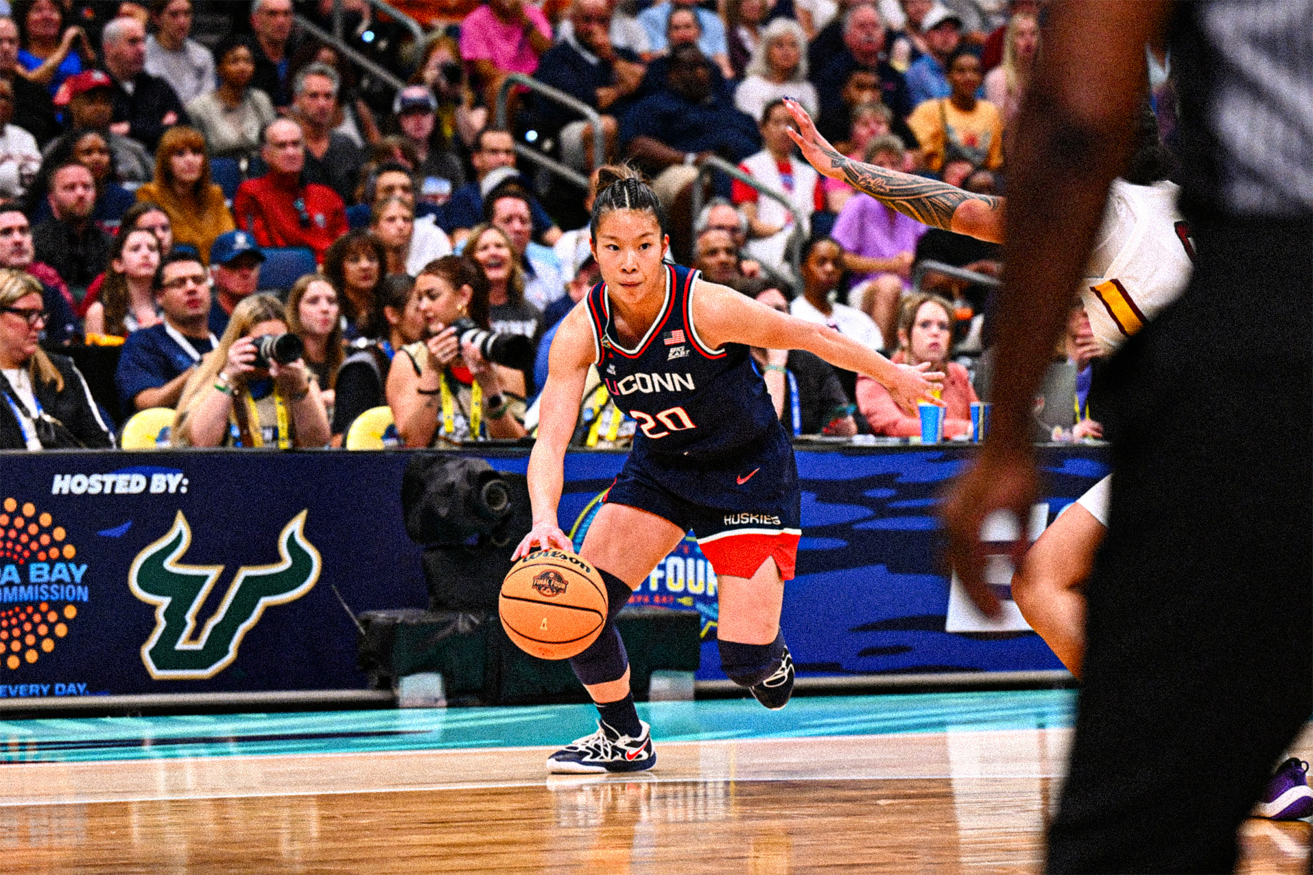 AMB_9706-sized Kaitlyn Chen drives past a South Carolina player towards the basket from just outside the three-point arc.
