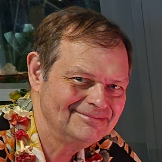 Zygmunt F. Dembek in floral Hawaiian printed shirt