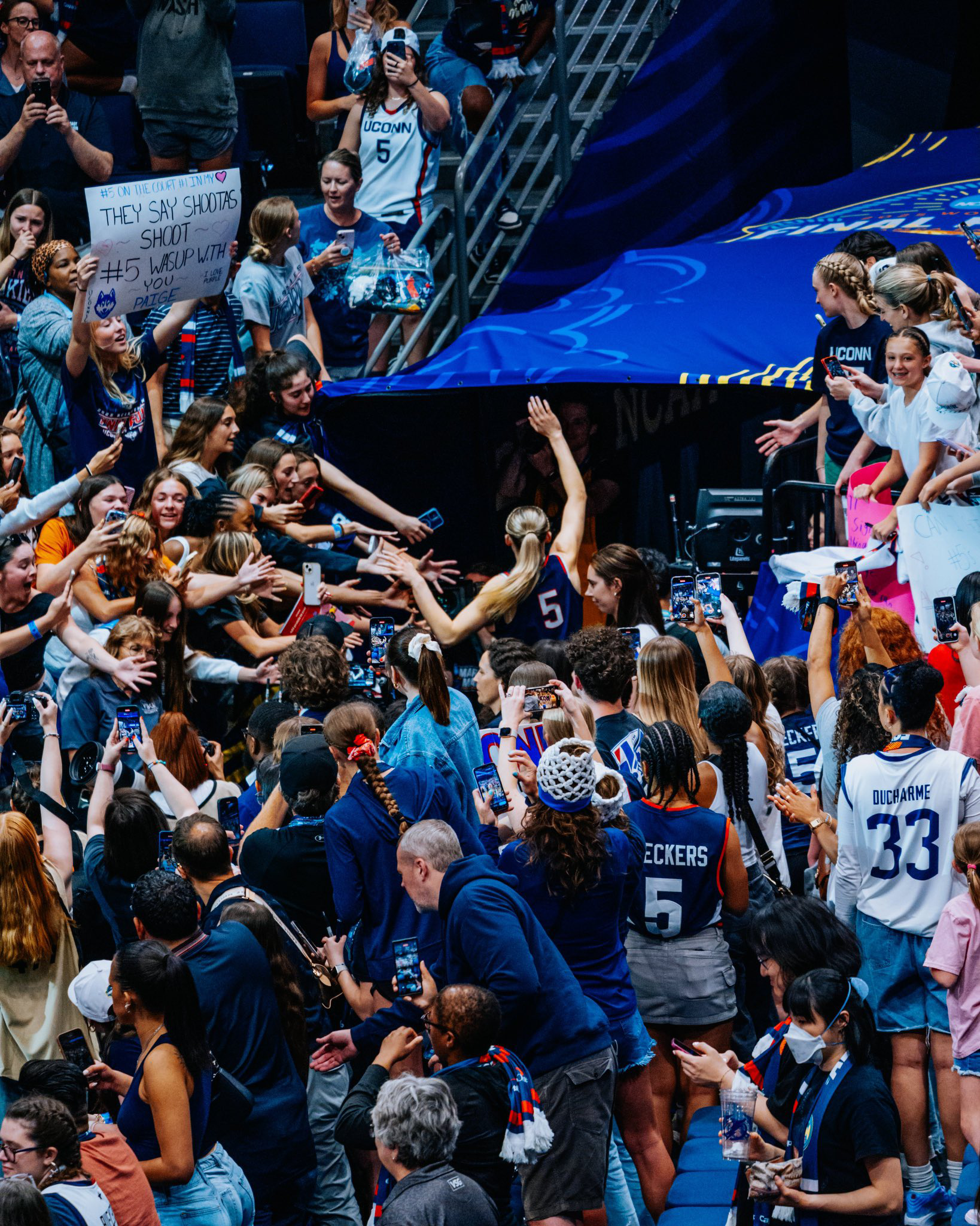 Gn0NSxEbYAE66Qy UConn crowd cheer and celebrate players in 2024-25 game celebrating UConn's basketball dynasty