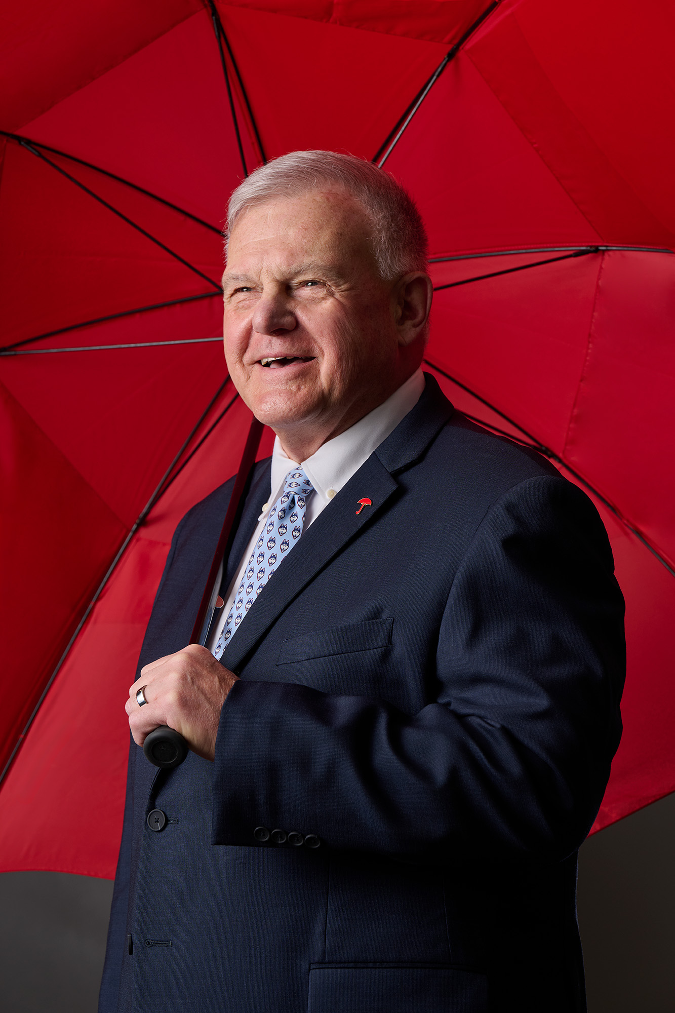 edit-Bessette_250324a352_CY Andy Bessette under a red umbrella